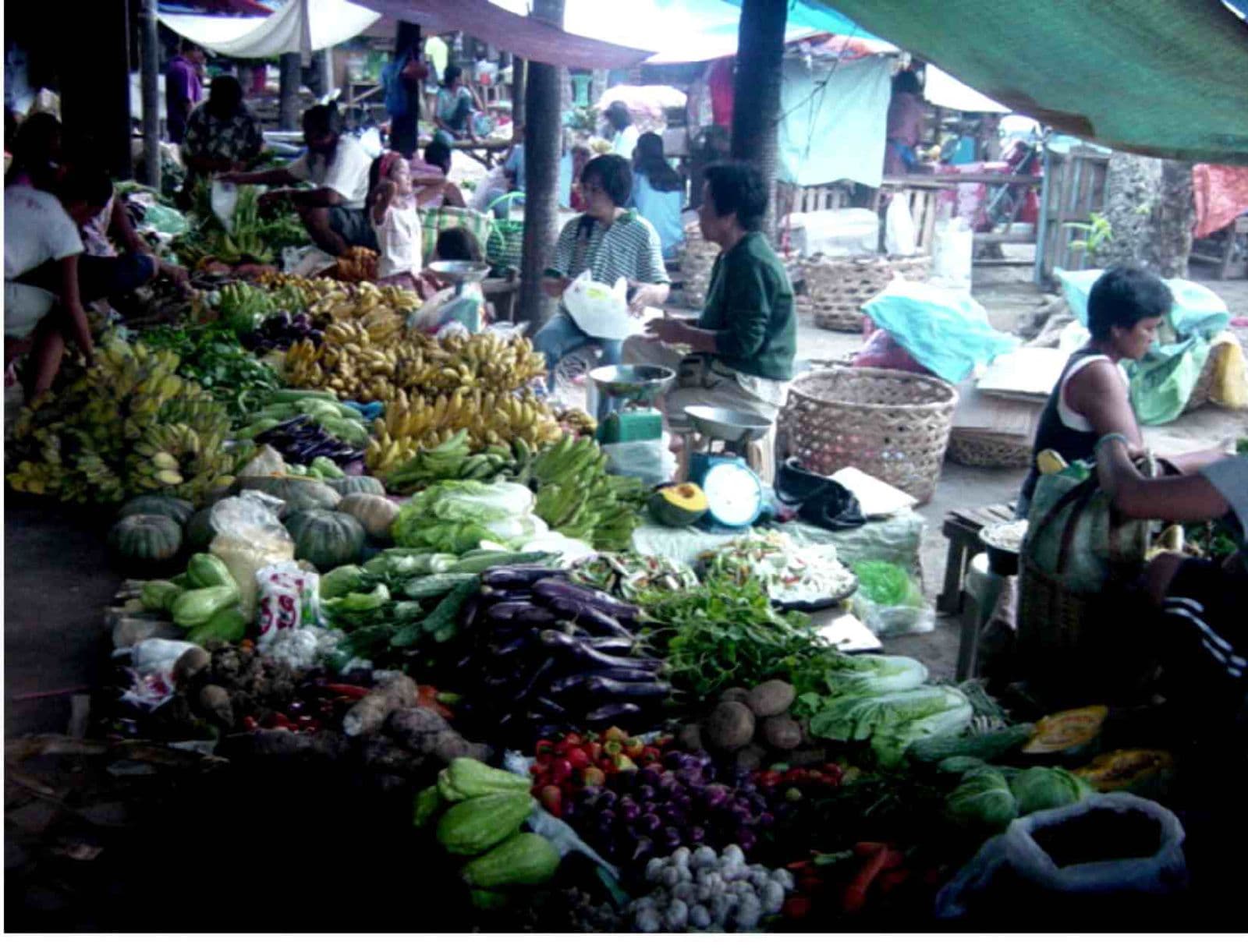 A local Filipino market vendor at their stall